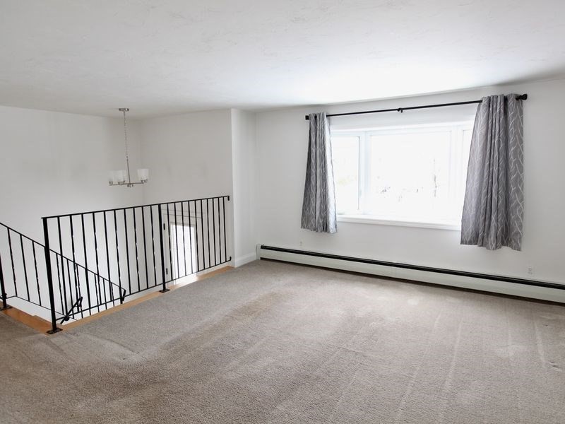 54 Ann Street Raynham, MA 02767 - Photo 8 of 21 a view of a room with wooden floor and a window