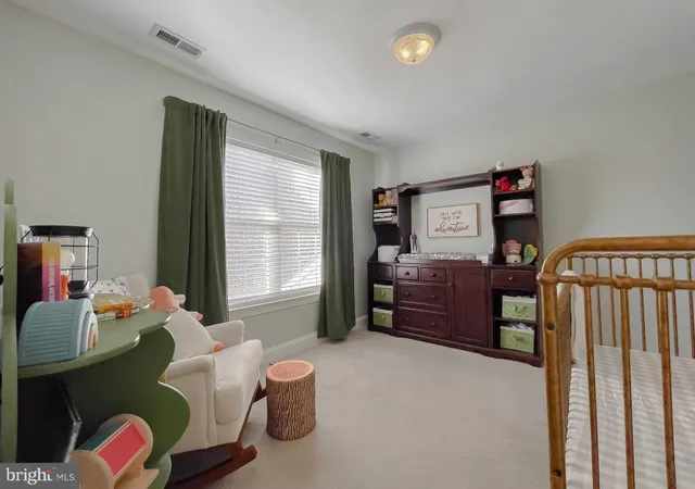 a bedroom with furniture and window