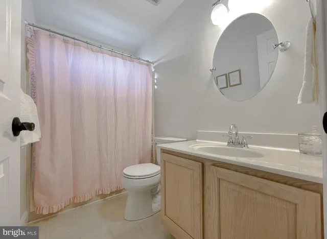 a house view with swimming pool in front of it