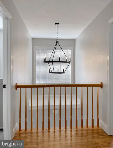 a view of a house with yard and sitting area