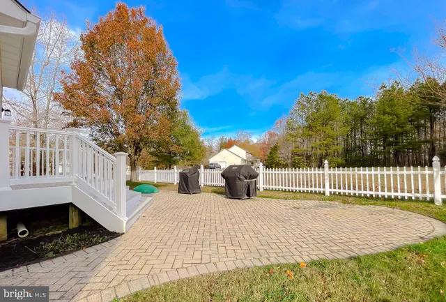 a view of a swimming pool with an outdoor space and seating area