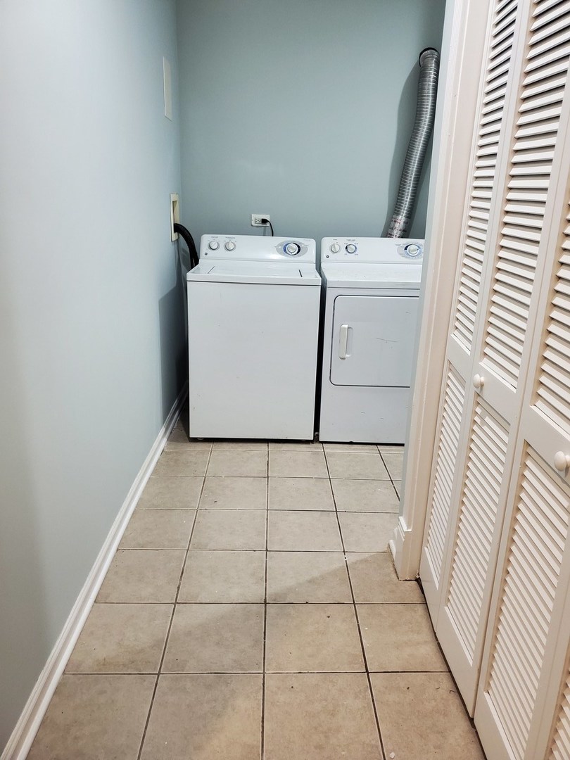 Undisclosed Address Chicago, IL 60645 - Photo 11 of 22 a utility room with dryer and washer