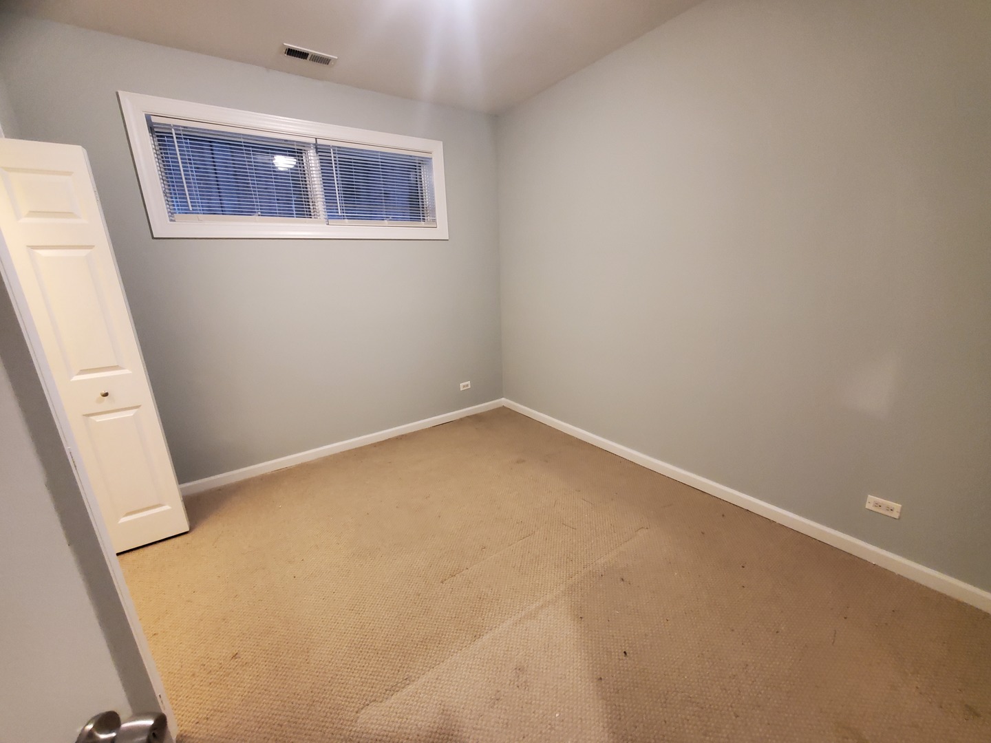 Undisclosed Address Chicago, IL 60645 - Photo 14 of 22 an empty room with a window