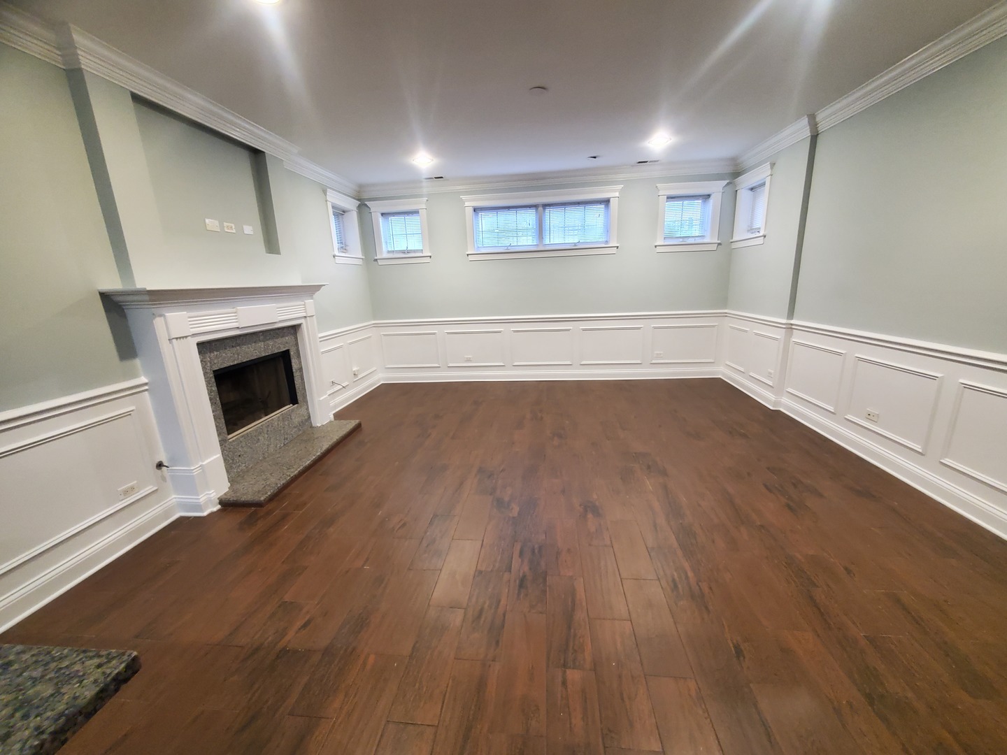 Undisclosed Address Chicago, IL 60645 - Photo 17 of 22 a view of empty room with wooden floor and fireplace