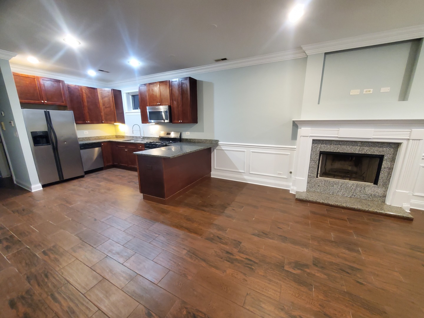 Undisclosed Address Chicago, IL 60645 - Photo 18 of 22 a large kitchen with cabinets and stainless steel appliances