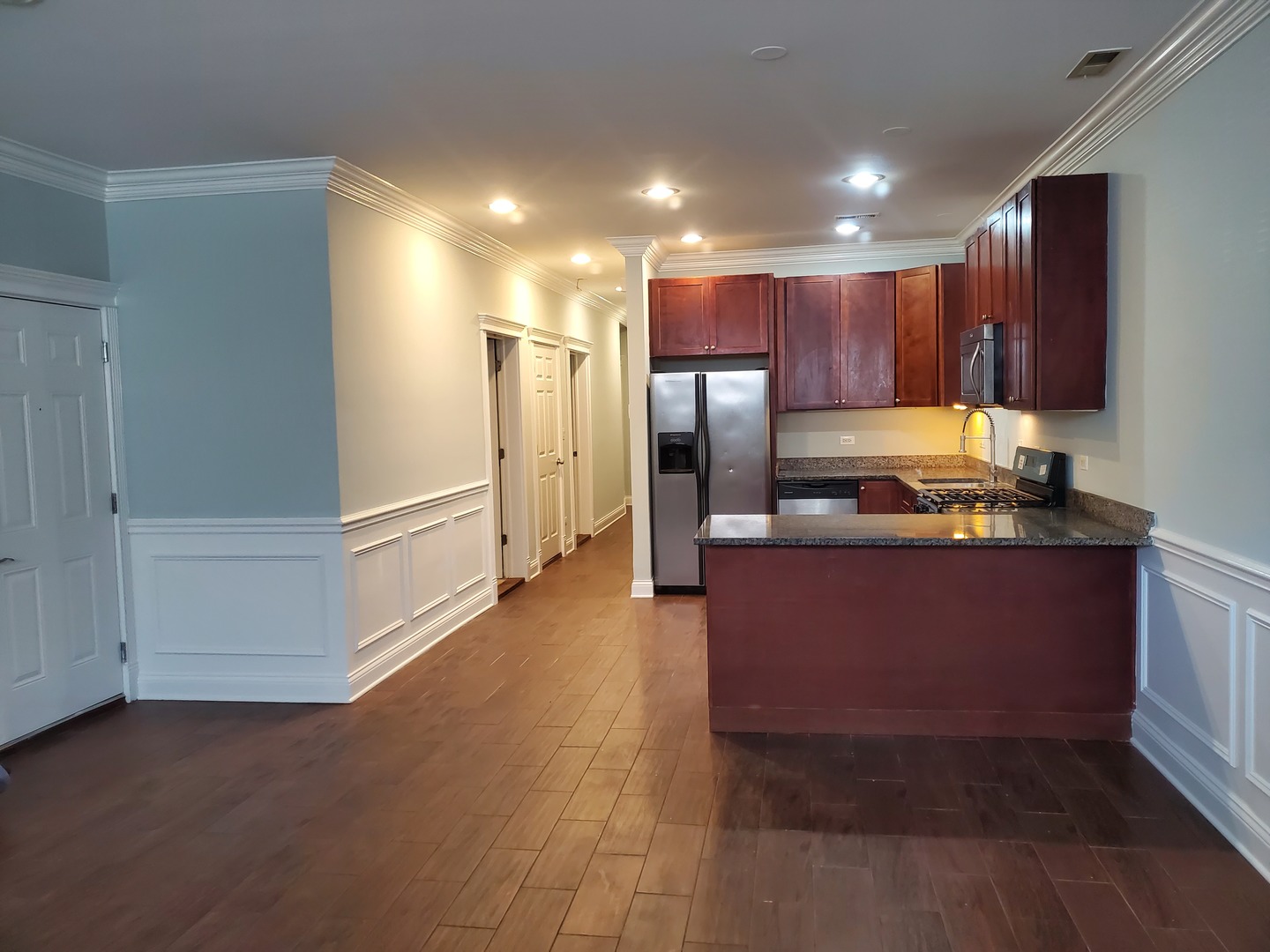 Undisclosed Address Chicago, IL 60645 - Photo 22 of 22 a kitchen with granite countertop a refrigerator and a sink