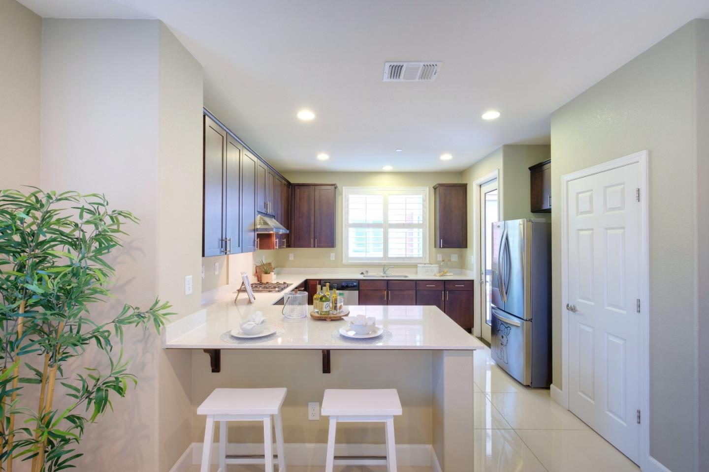 1059 Eagle Way San Jose, CA 95131 - Photo 11 of 56 a kitchen with a table and chairs in it