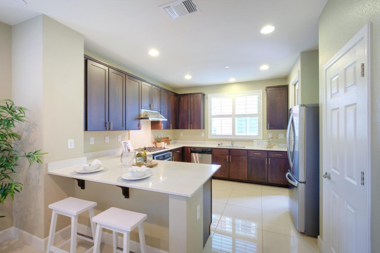 1059 Eagle Way San Jose, CA 95131 - Photo 12 of 56 a kitchen with a sink refrigerator and cabinets