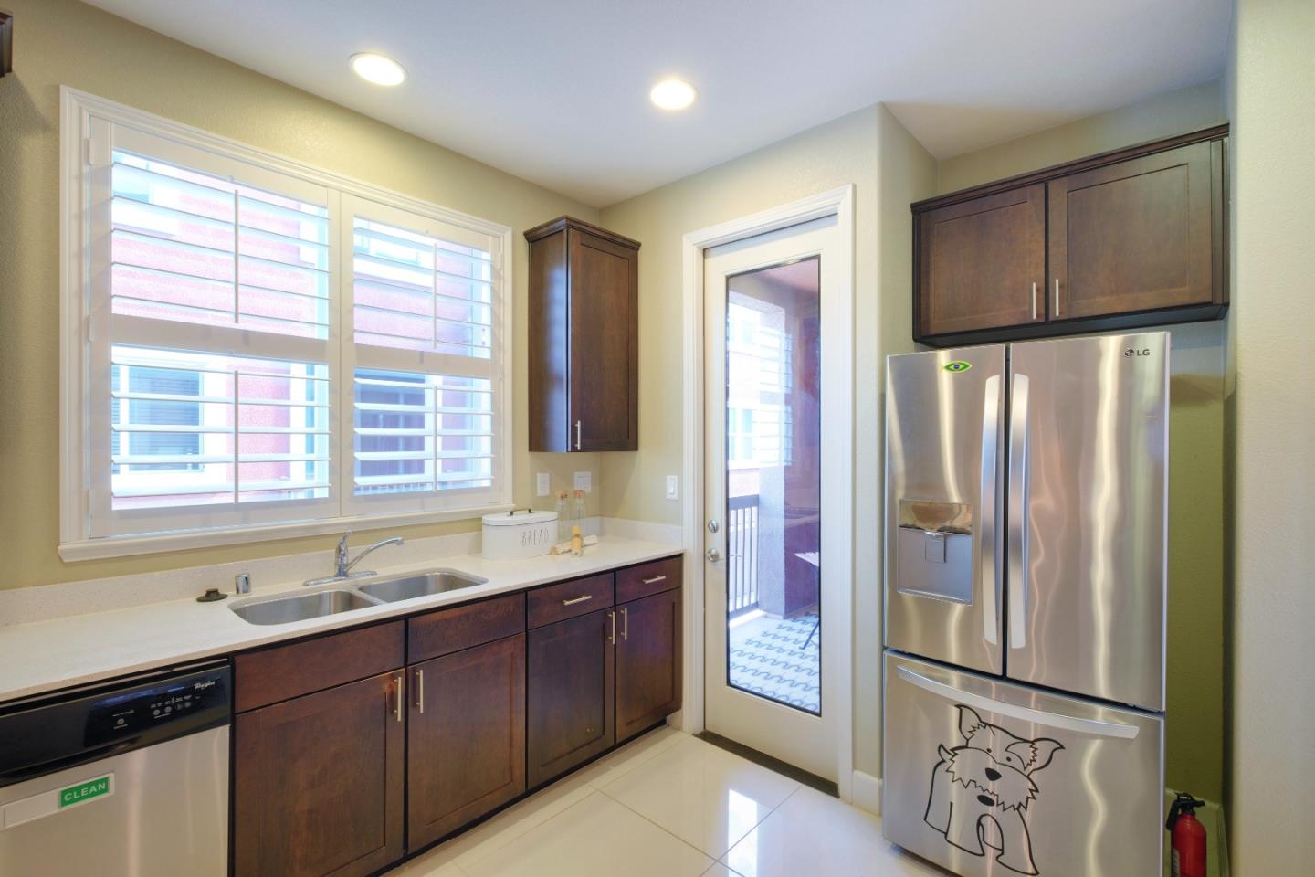 1059 Eagle Way San Jose, CA 95131 - Photo 16 of 56 a kitchen with stainless steel appliances granite countertop a refrigerator and a sink