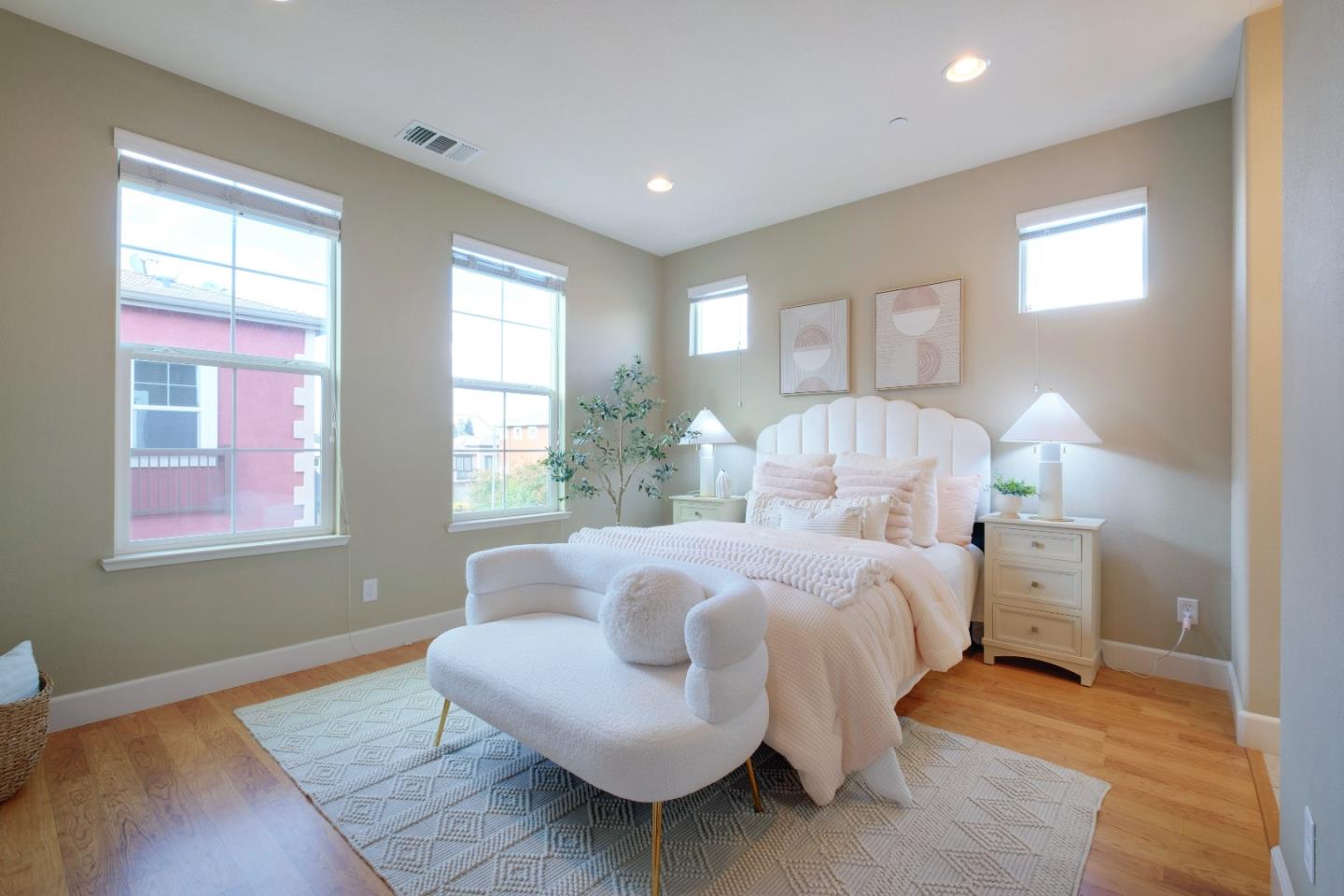 1059 Eagle Way San Jose, CA 95131 - Photo 18 of 56 a spacious bedroom with a bed and wooden floor