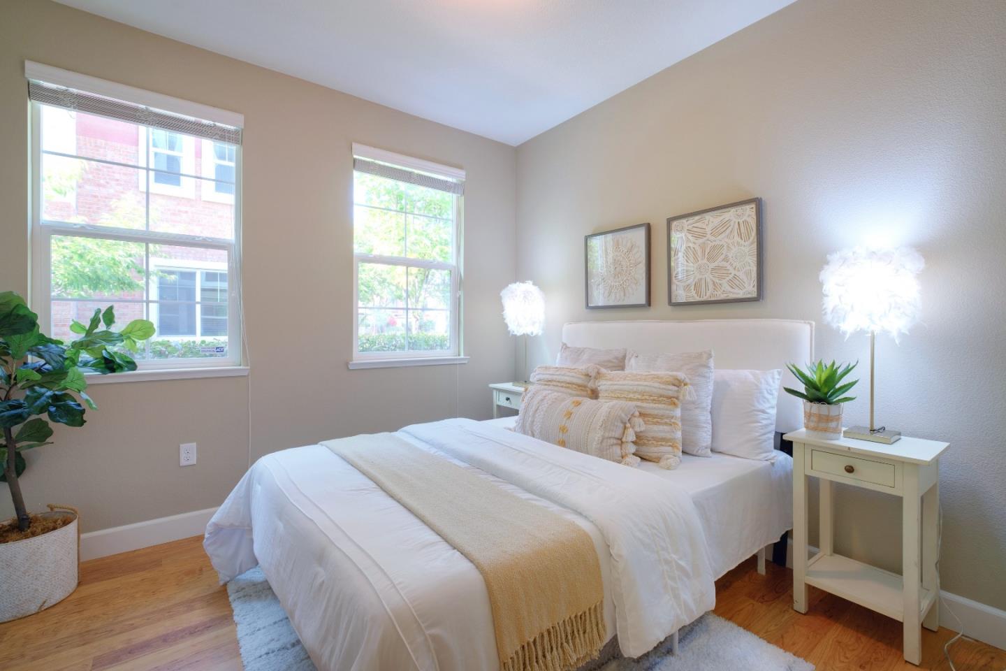 1059 Eagle Way San Jose, CA 95131 - Photo 25 of 56 a bedroom with a bed and a potted plant