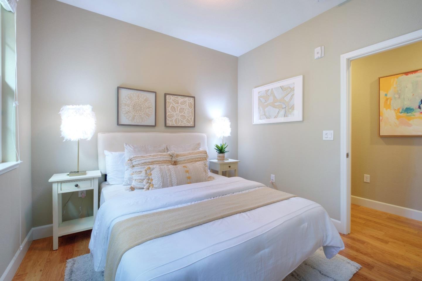 1059 Eagle Way San Jose, CA 95131 - Photo 26 of 56 a bedroom with a bed and wooden floor