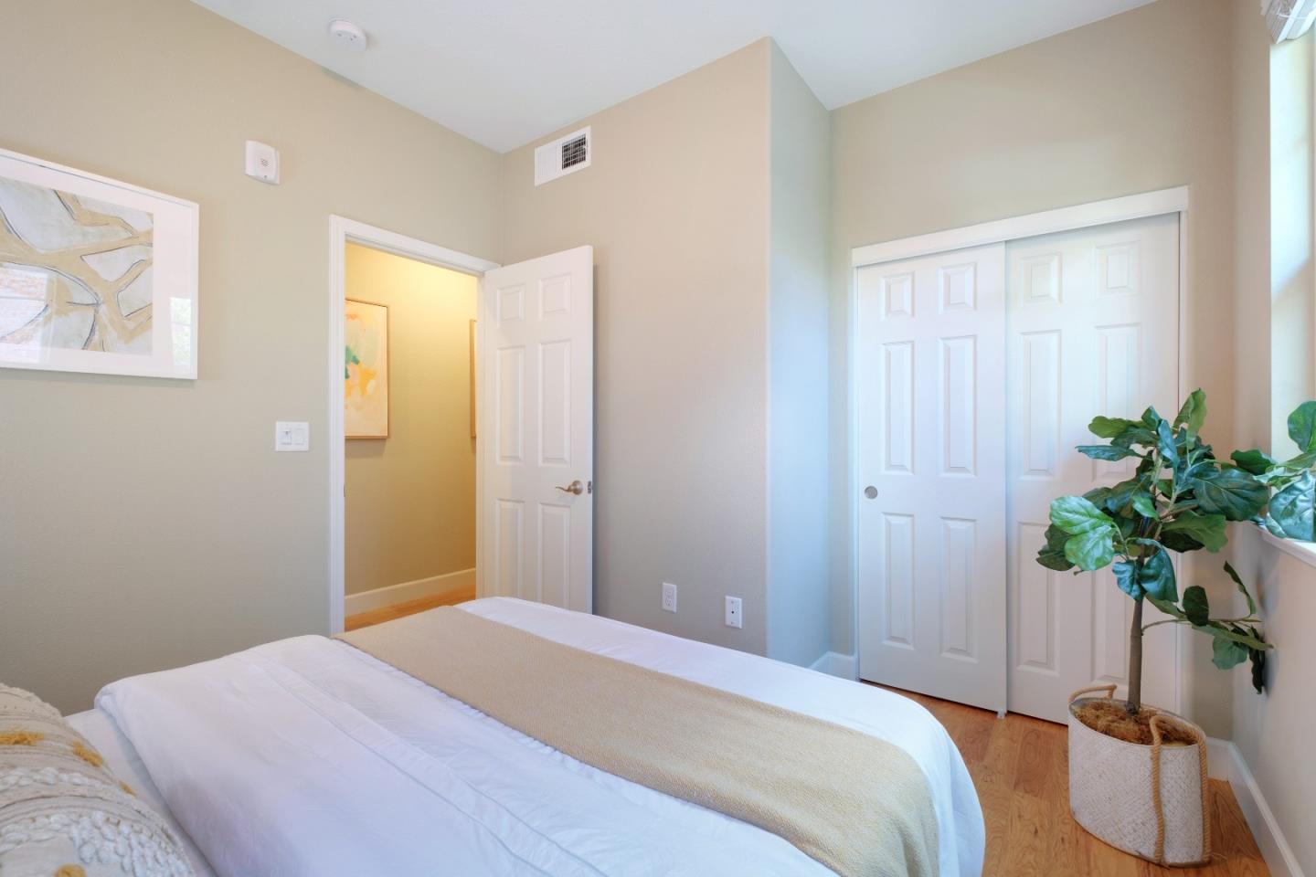1059 Eagle Way San Jose, CA 95131 - Photo 27 of 56 a bedroom with a bed and hallway