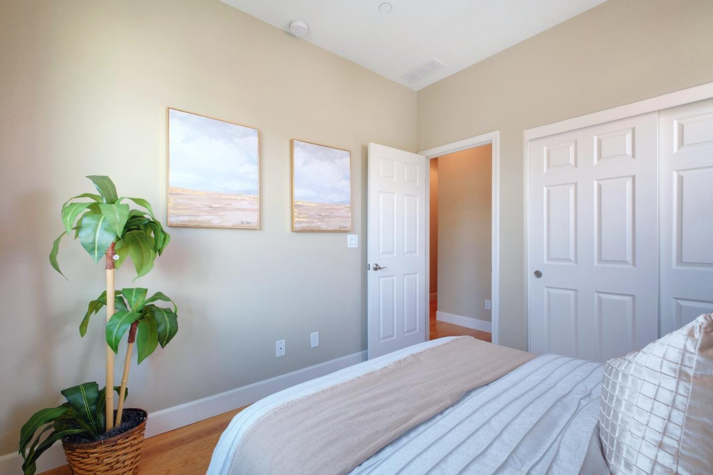 1059 Eagle Way San Jose, CA 95131 - Photo 30 of 56 a bedroom with a bed potted plant and the dresser