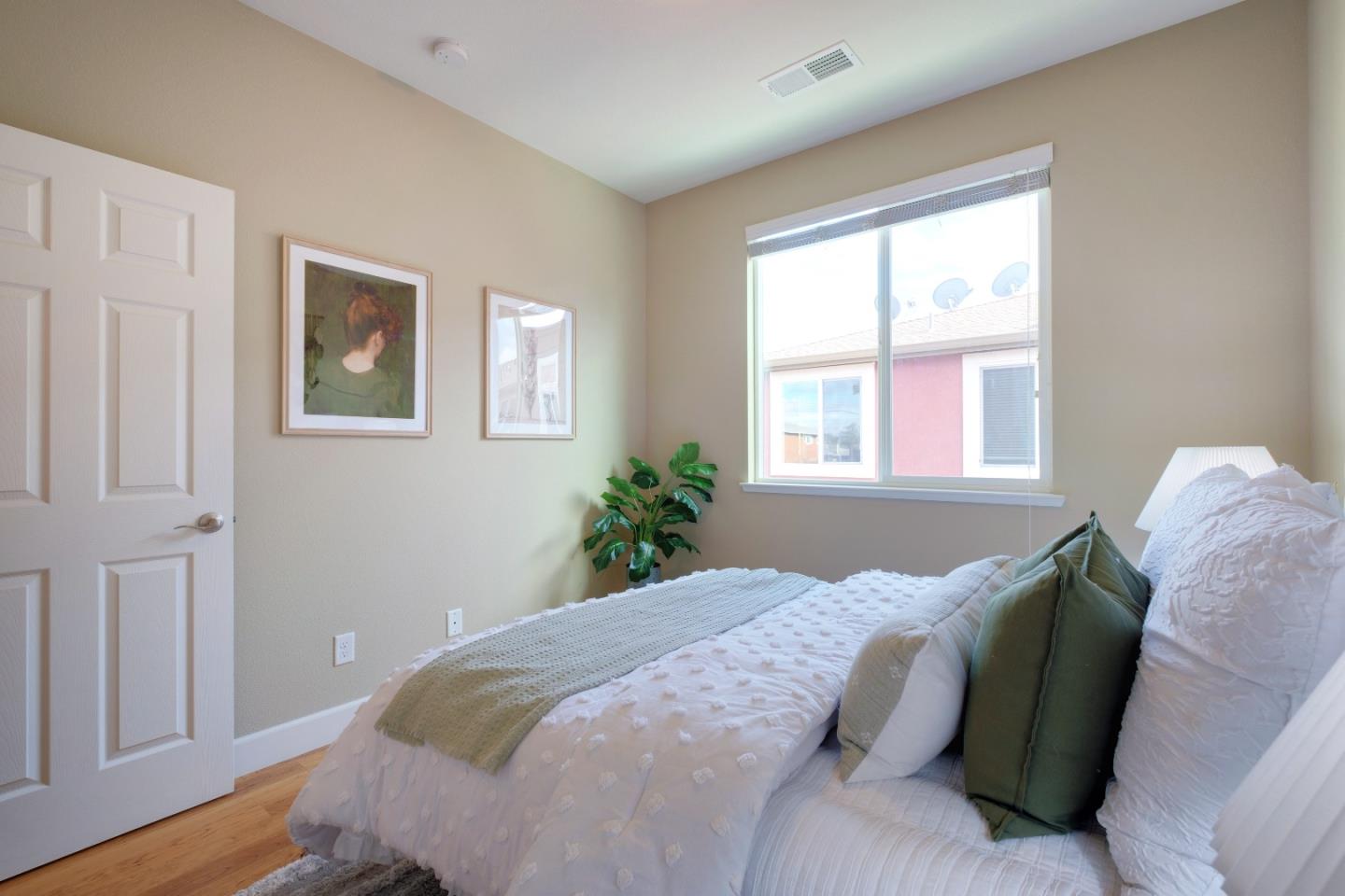 1059 Eagle Way San Jose, CA 95131 - Photo 32 of 56 a bed sitting in a bedroom next to a window