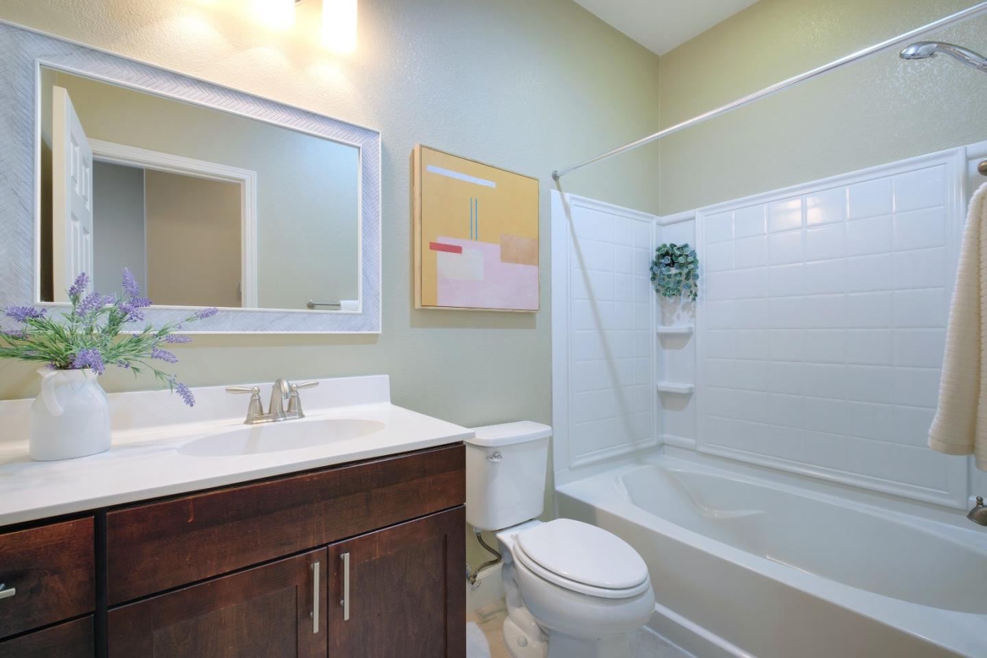 1059 Eagle Way San Jose, CA 95131 - Photo 35 of 56 a bathroom with a sink a toilet and shower