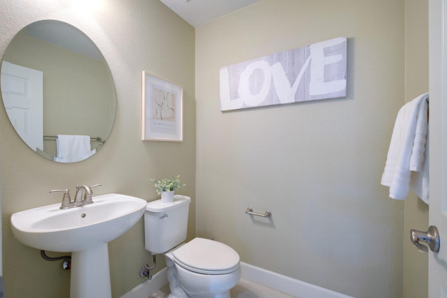 1059 Eagle Way San Jose, CA 95131 - Photo 36 of 56 a bathroom with a sink mirror and toilet