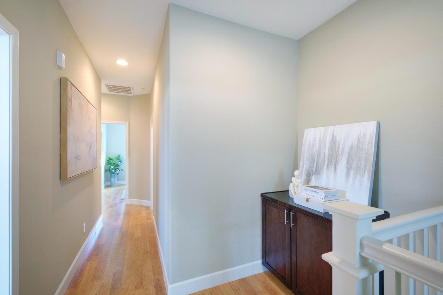 1059 Eagle Way San Jose, CA 95131 - Photo 37 of 56 a view of a hallway with wooden floor and staircase