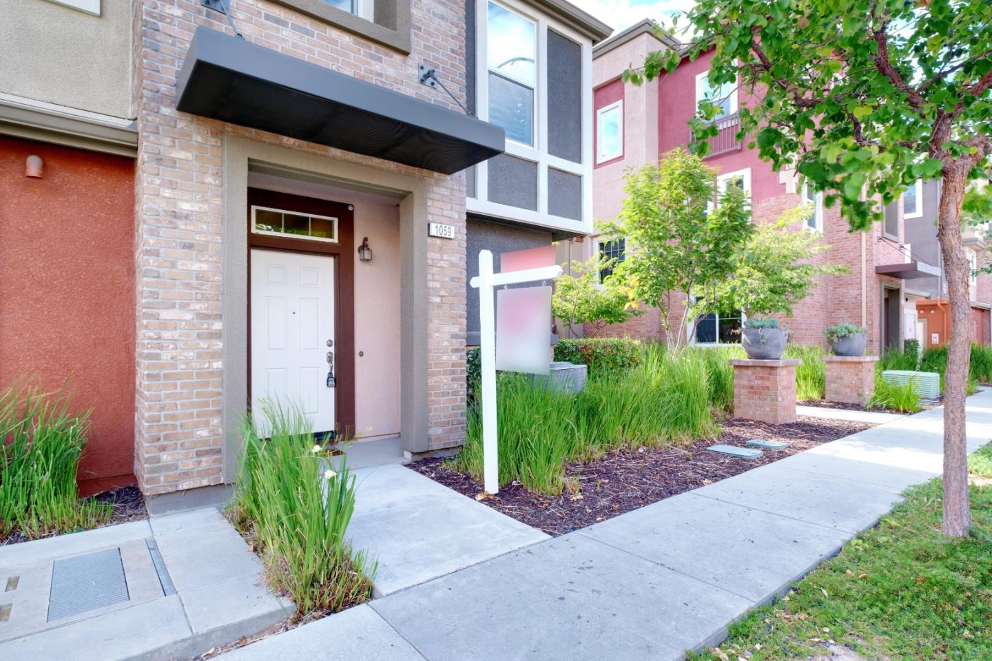 1059 Eagle Way San Jose, CA 95131 - Photo 4 of 56 a front view of a house with garden