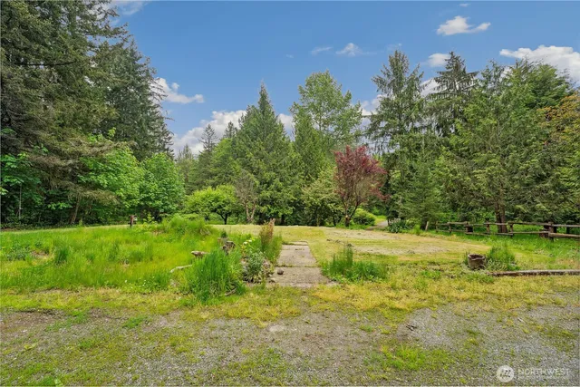 a view of a grassy area with an trees