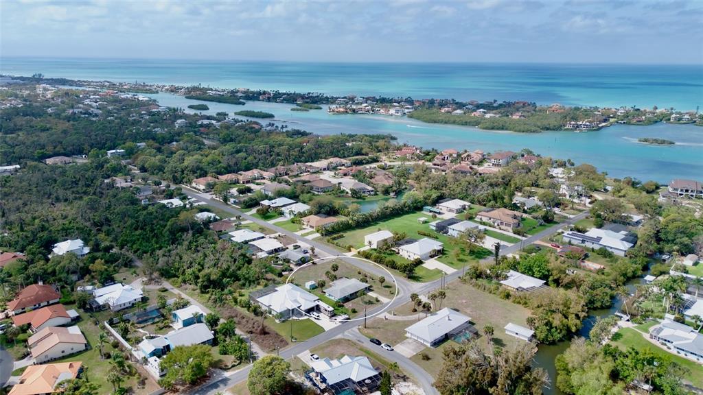 223 Roberts Road Nokomis, FL 34275 - Photo 2 of 27 an aerial view of a city with mountains