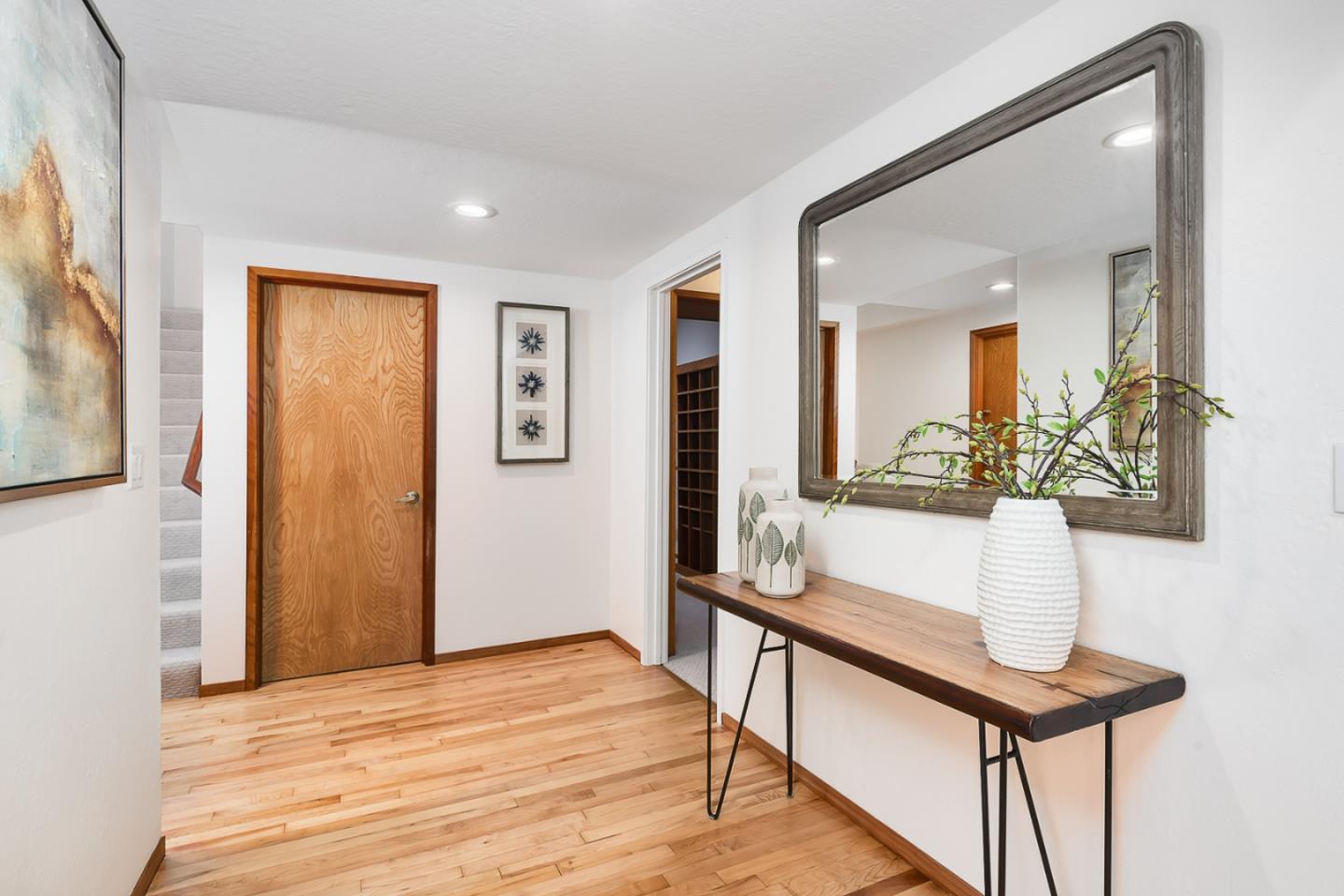 3217 Upper Lock Avenue Belmont, CA 94002 - Photo 13 of 59 a hallway with a table and a potted plant