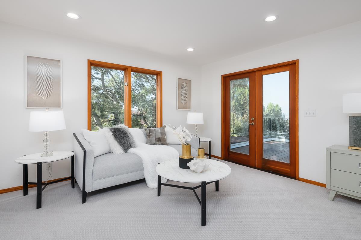 3217 Upper Lock Avenue Belmont, CA 94002 - Photo 17 of 59 a living room with furniture and a large window