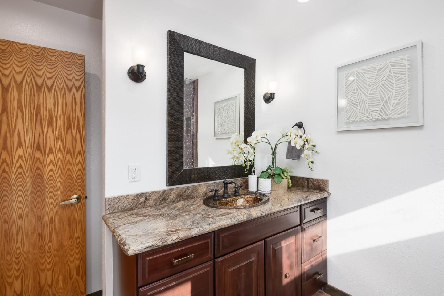 3217 Upper Lock Avenue Belmont, CA 94002 - Photo 19 of 59 a bathroom with a granite countertop sink and a mirror