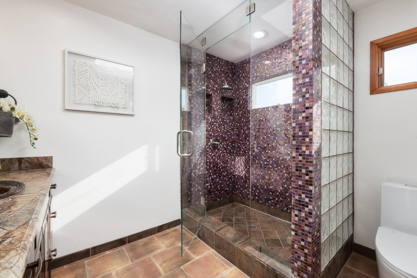 3217 Upper Lock Avenue Belmont, CA 94002 - Photo 20 of 59 a bathroom with a bathtub and shower