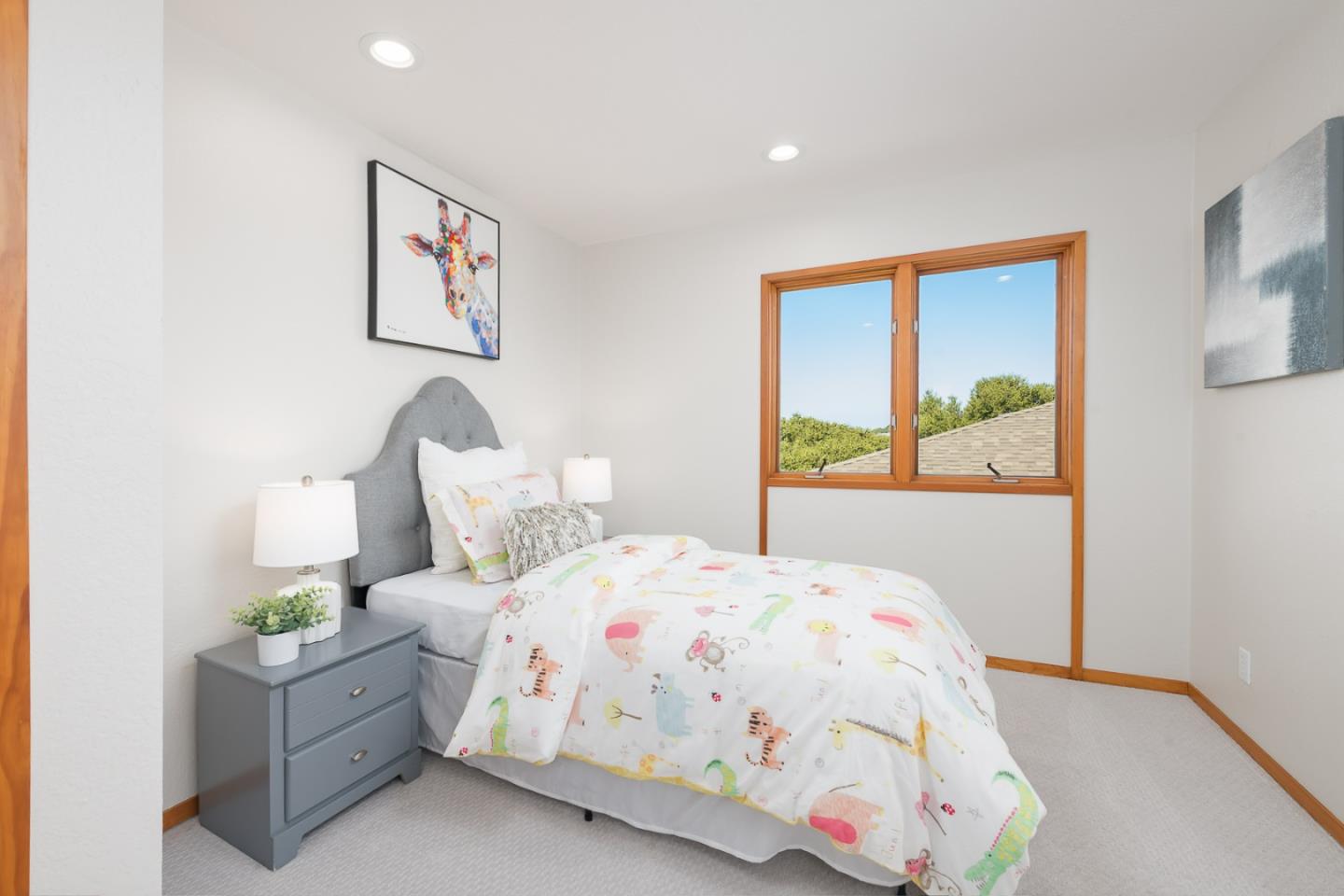 3217 Upper Lock Avenue Belmont, CA 94002 - Photo 26 of 59 a bedroom with a bed and a painting on the wall