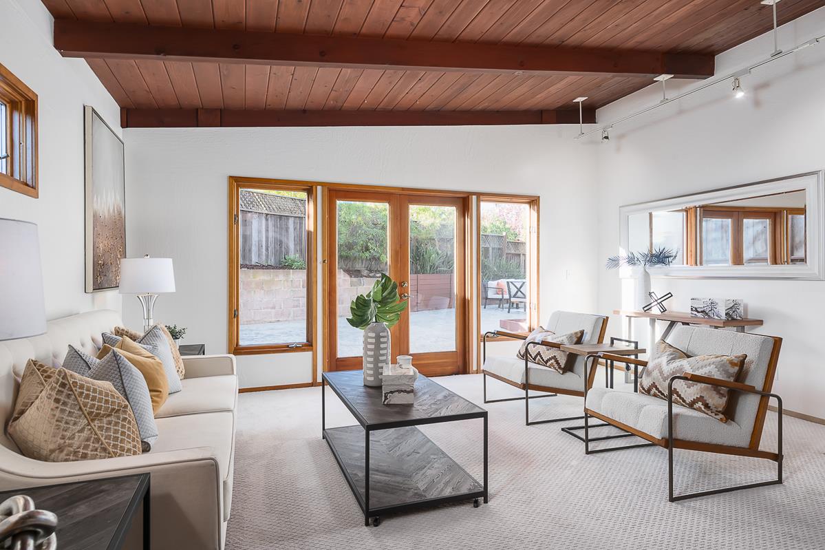 3217 Upper Lock Avenue Belmont, CA 94002 - Photo 3 of 59 a living room with furniture and a floor to ceiling window