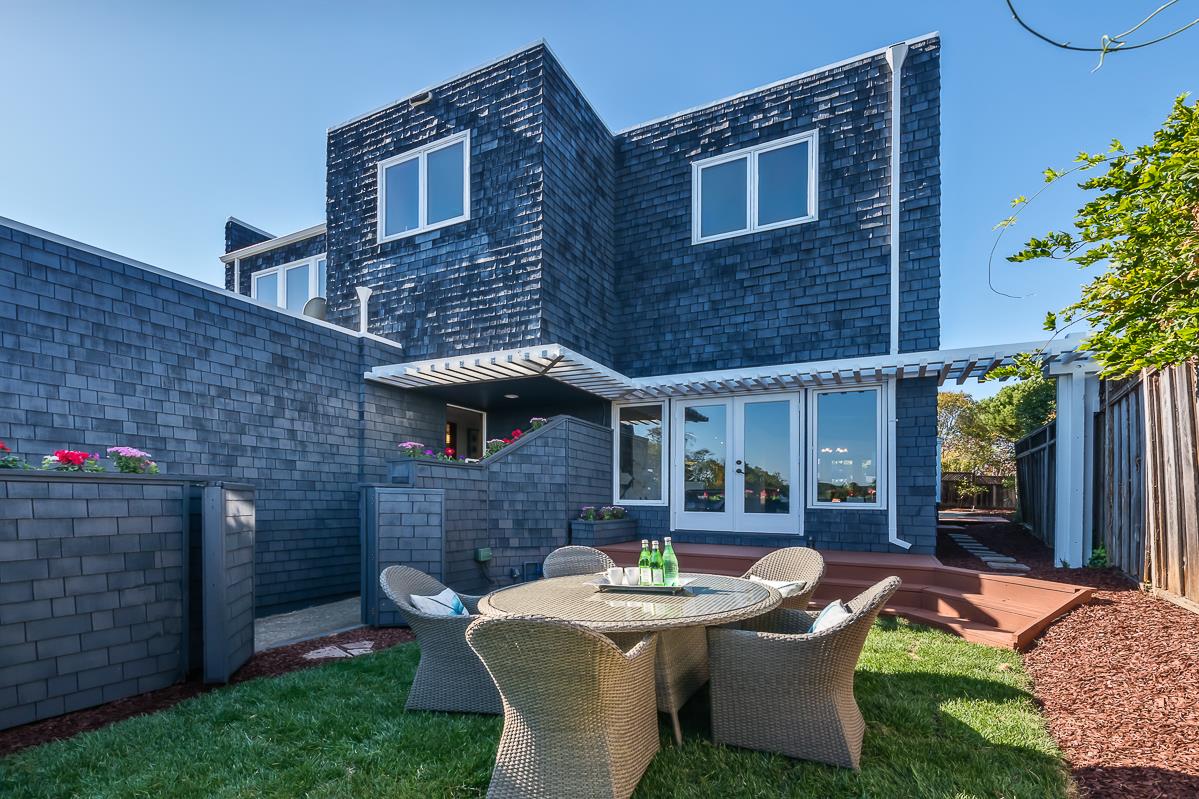 3217 Upper Lock Avenue Belmont, CA 94002 - Photo 32 of 59 a patio with table and chairs and potted plants
