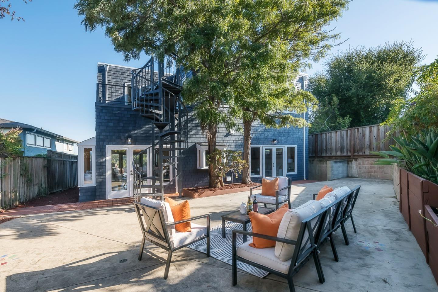 3217 Upper Lock Avenue Belmont, CA 94002 - Photo 33 of 59 a outdoor space with patio furniture and wooden floor