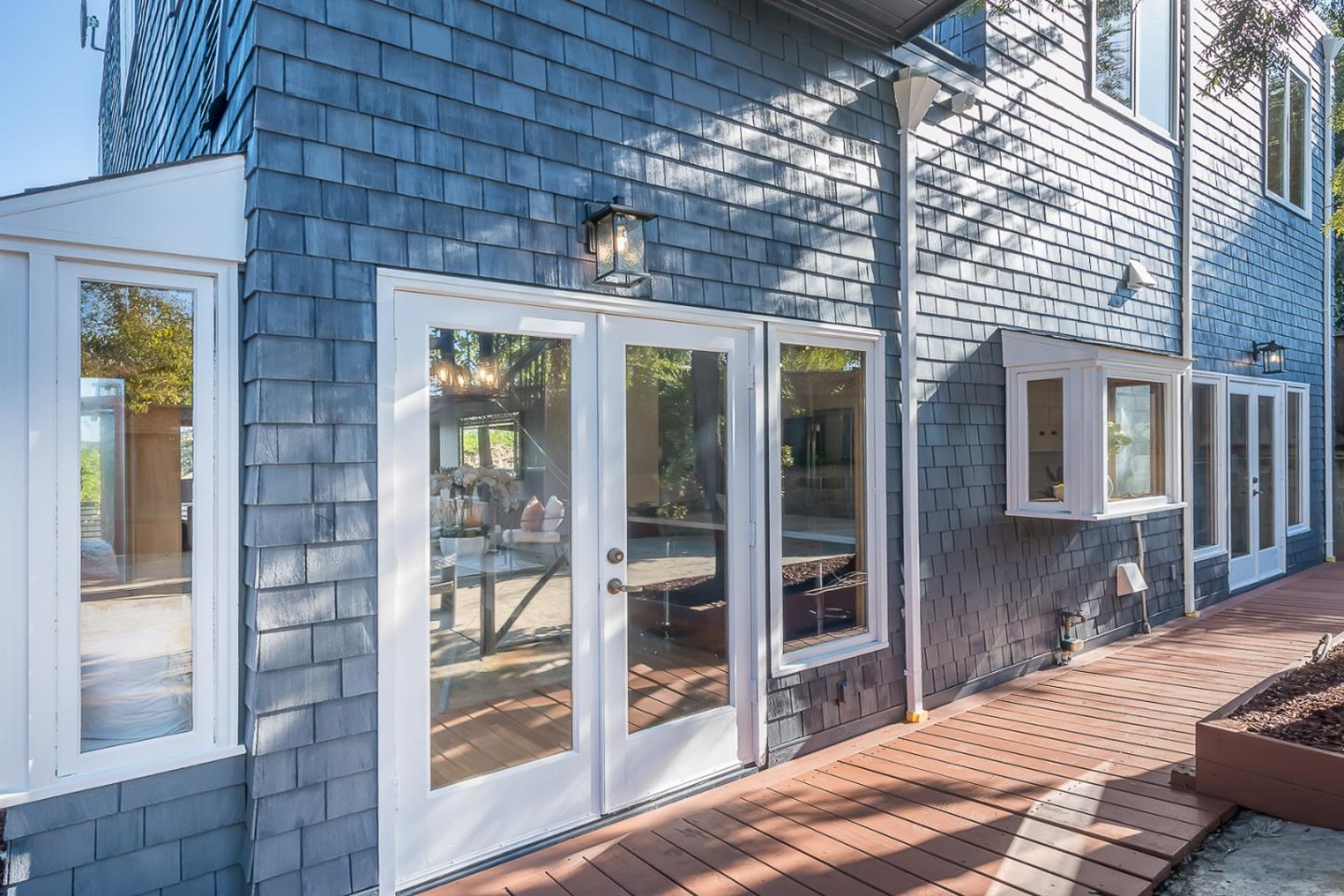 3217 Upper Lock Avenue Belmont, CA 94002 - Photo 36 of 59 a large room with a bed and glass door