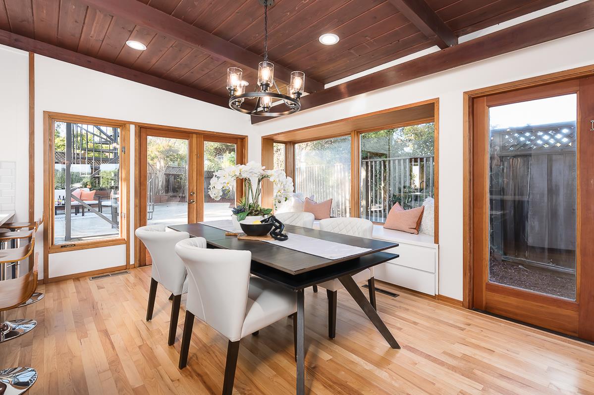 3217 Upper Lock Avenue Belmont, CA 94002 - Photo 4 of 59 a view of a dining room with furniture wooden floor and chandelier