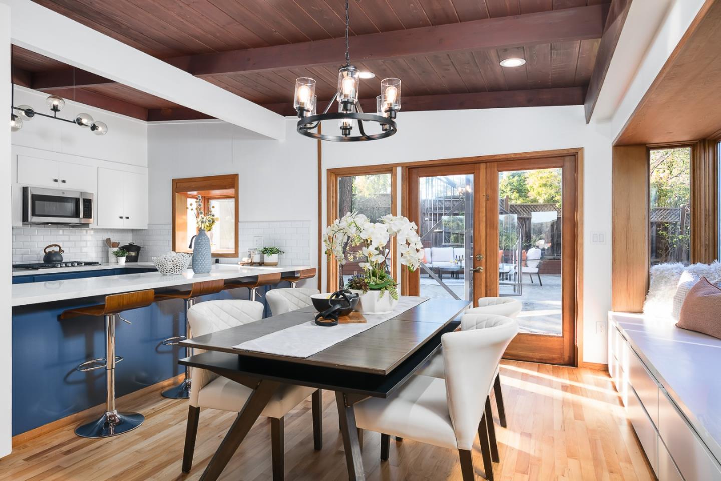 3217 Upper Lock Avenue Belmont, CA 94002 - Photo 5 of 59 a view of a dining room with furniture wooden floor and chandelier