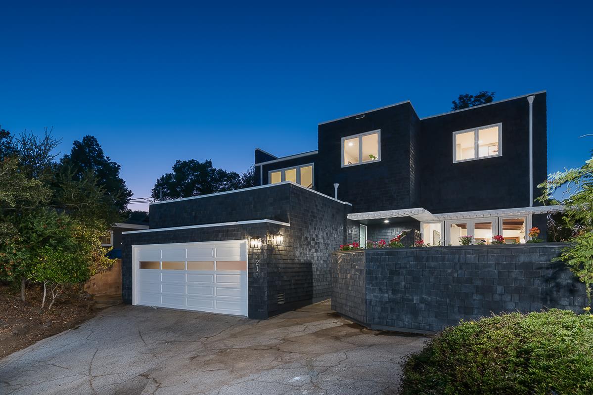 3217 Upper Lock Avenue Belmont, CA 94002 - Photo 51 of 59 a front view of a house with a yard