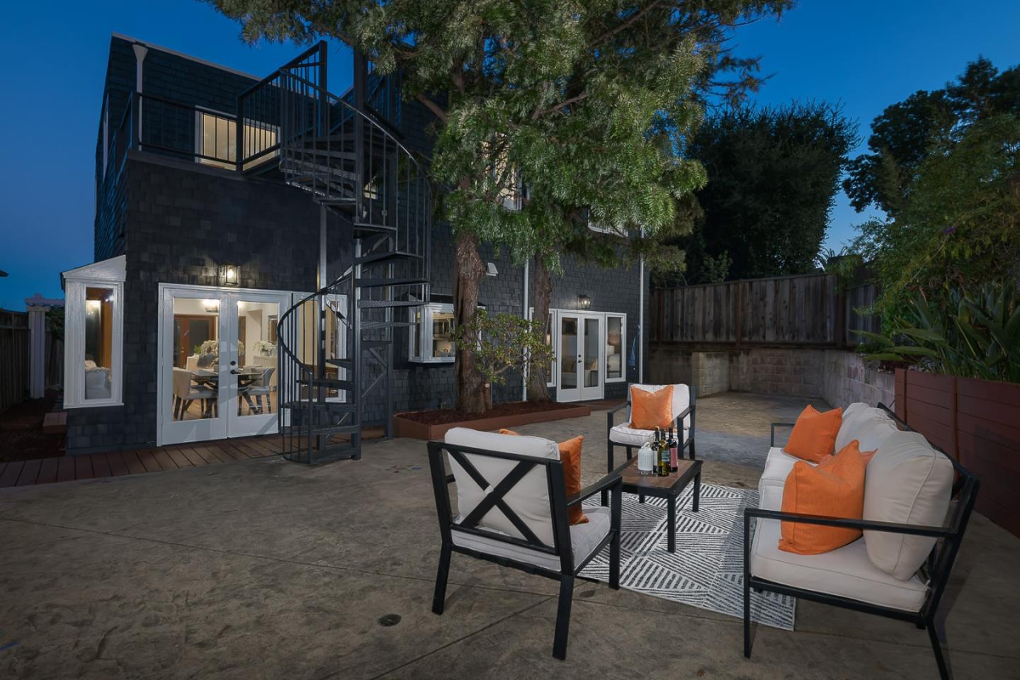 3217 Upper Lock Avenue Belmont, CA 94002 - Photo 59 of 59 a backyard of a house with table and chairs
