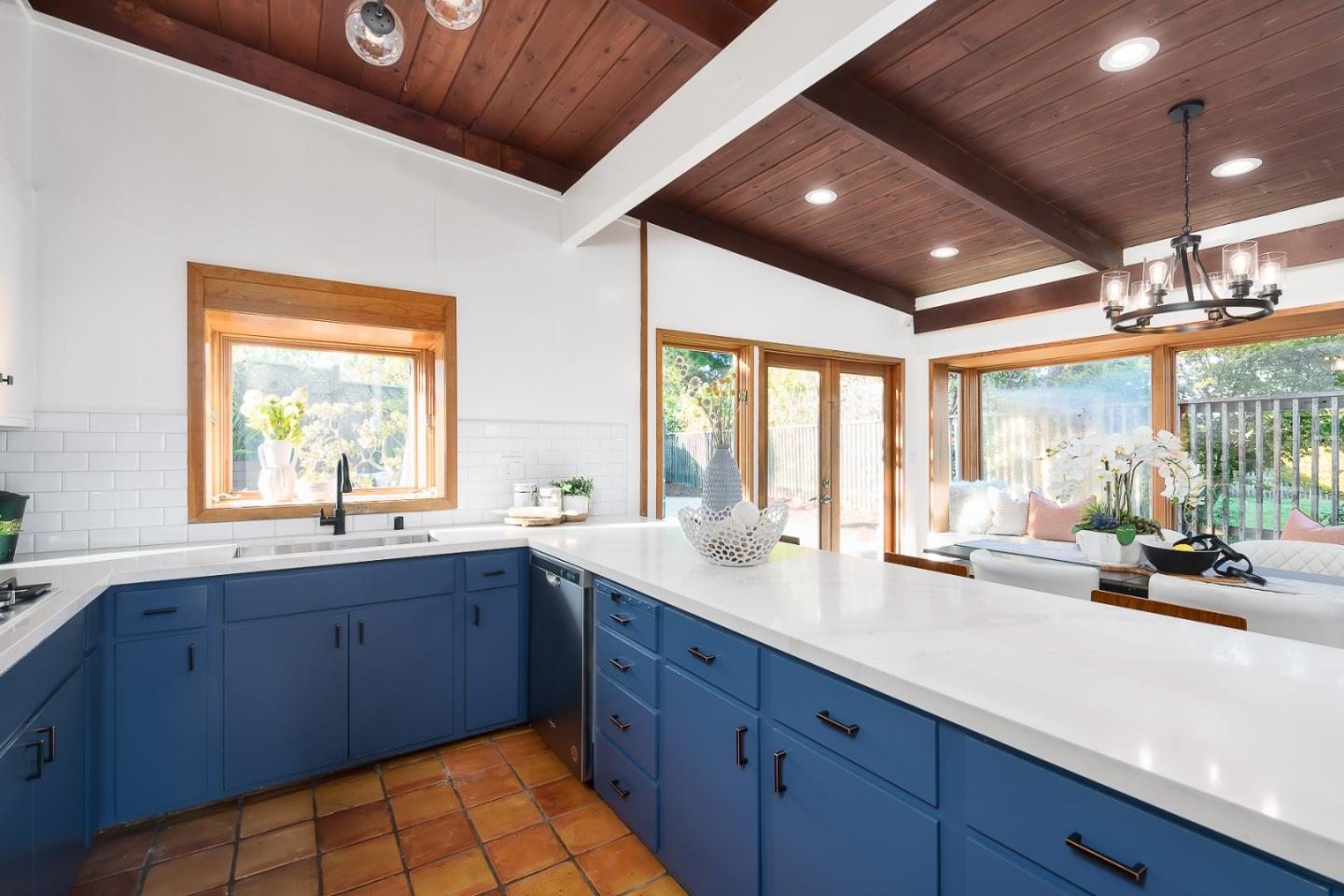 3217 Upper Lock Avenue Belmont, CA 94002 - Photo 7 of 59 a kitchen with a sink and large windows