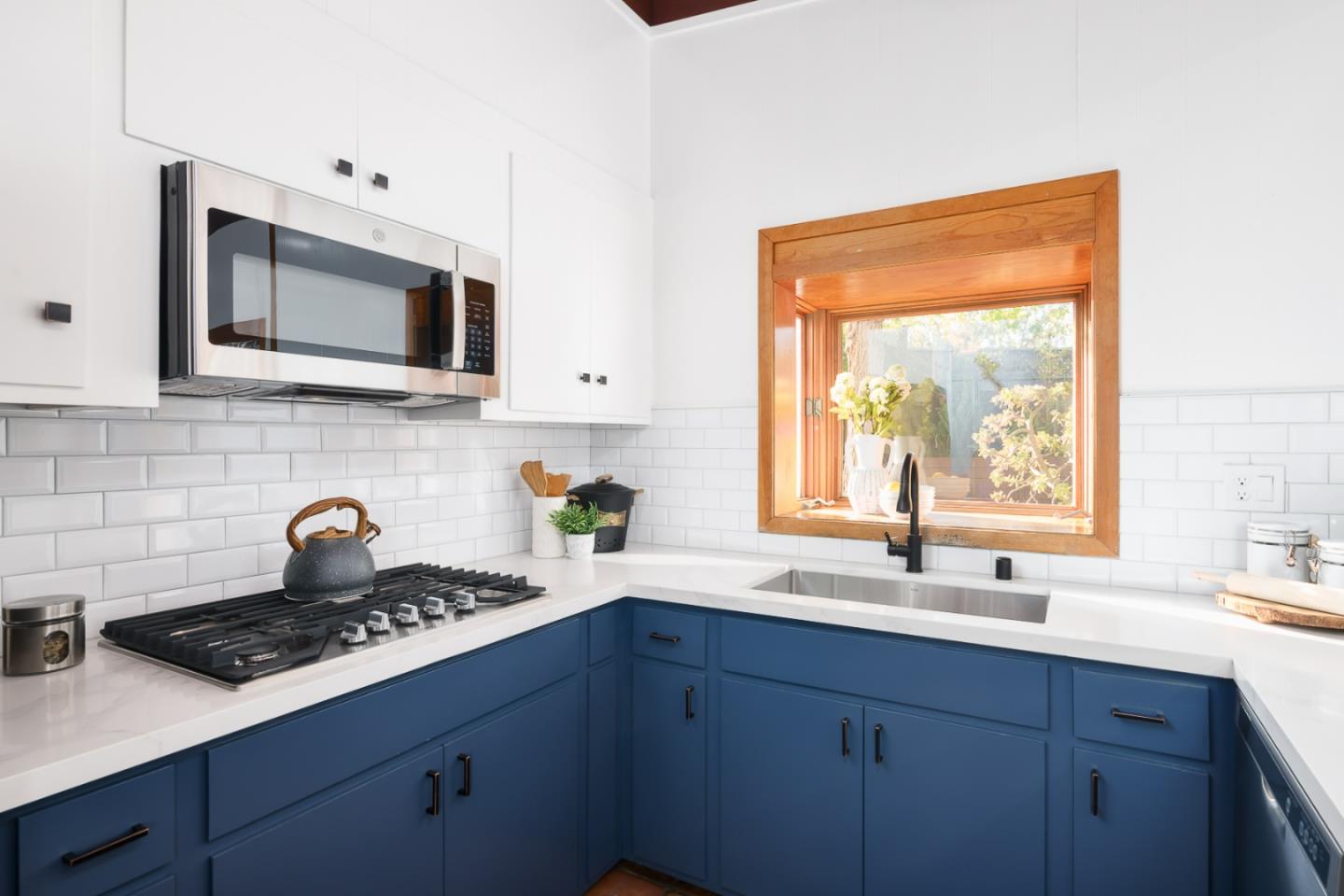3217 Upper Lock Avenue Belmont, CA 94002 - Photo 8 of 59 a kitchen with a sink stove and microwave