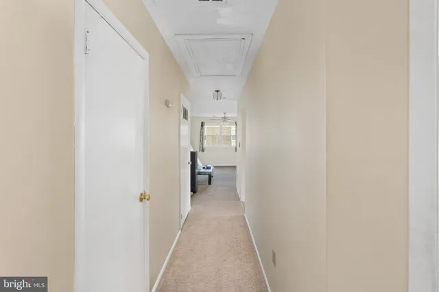a view of a hallway with a white walls