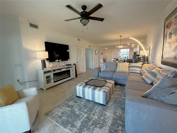 a spacious bedroom with a bed and a chair