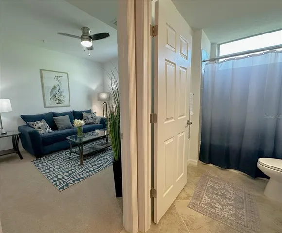 a living room with furniture and a large window