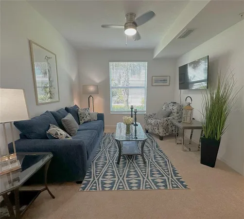 a living room with furniture and a window