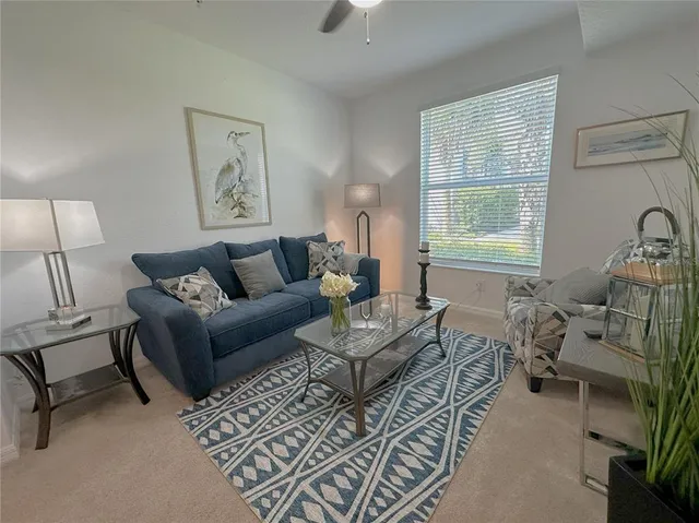 a spacious bedroom with a bed and a window