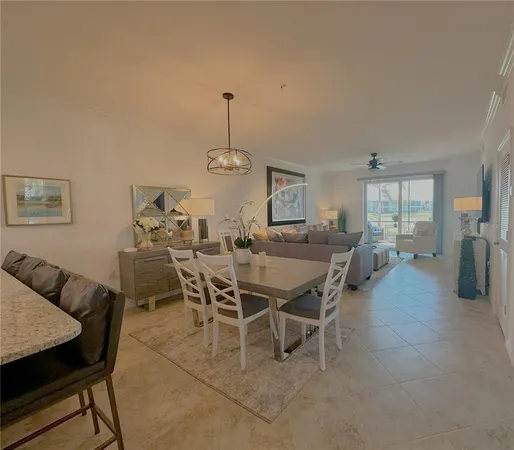 a dining room with furniture a window and kitchen view