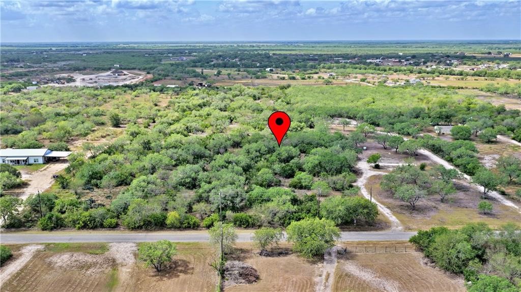 0 County Rd 3075 Orange Grove, TX 78372 - Photo 3 of 9 an aerial view of residential houses with outdoor space and trees