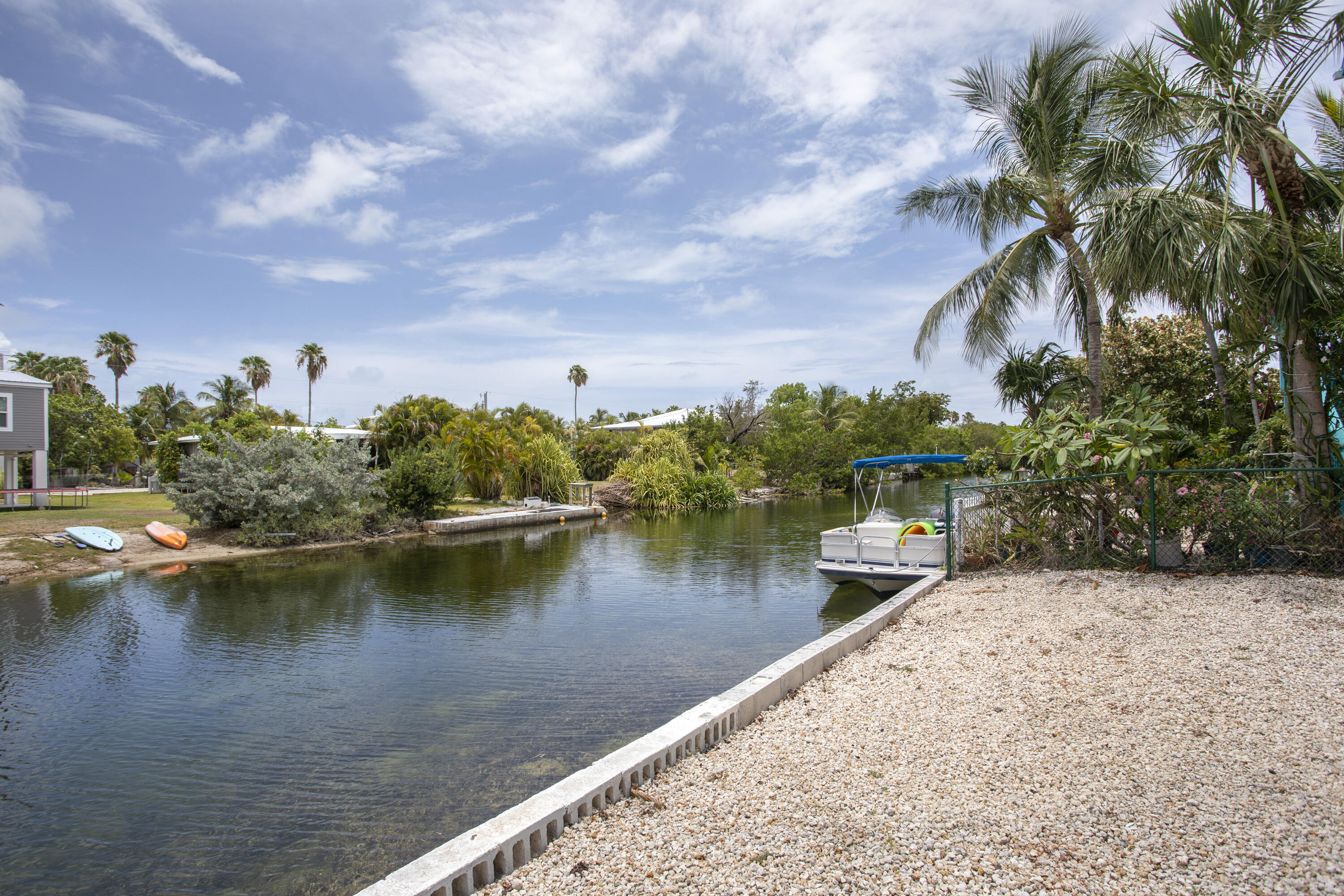 59 Palm Drive Key West, FL 33040 - Photo 2 of 14 a view of a lake with houses in the back