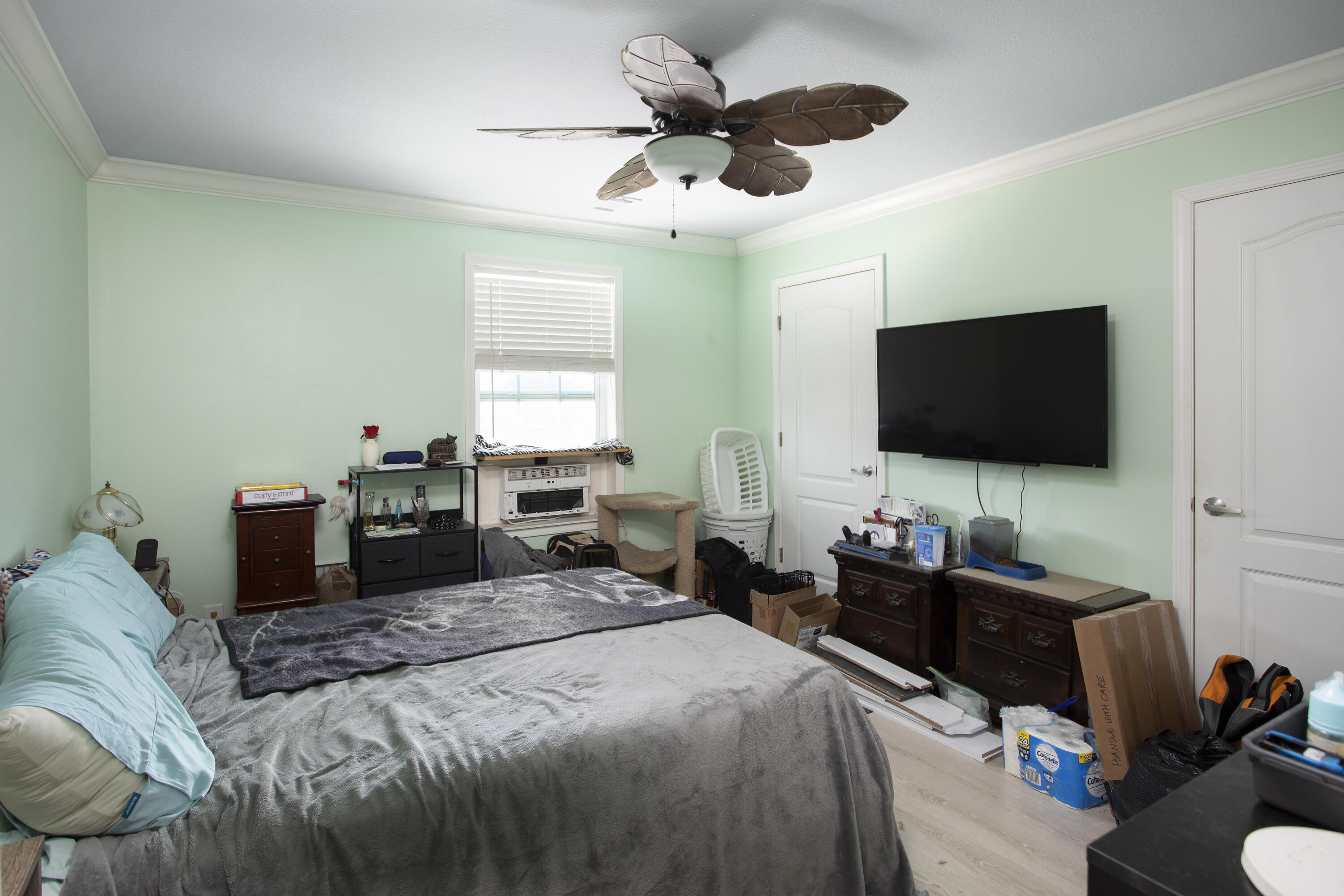 59 Palm Drive Key West, FL 33040 - Photo 14 of 14 a bedroom with a bed and a flat screen tv