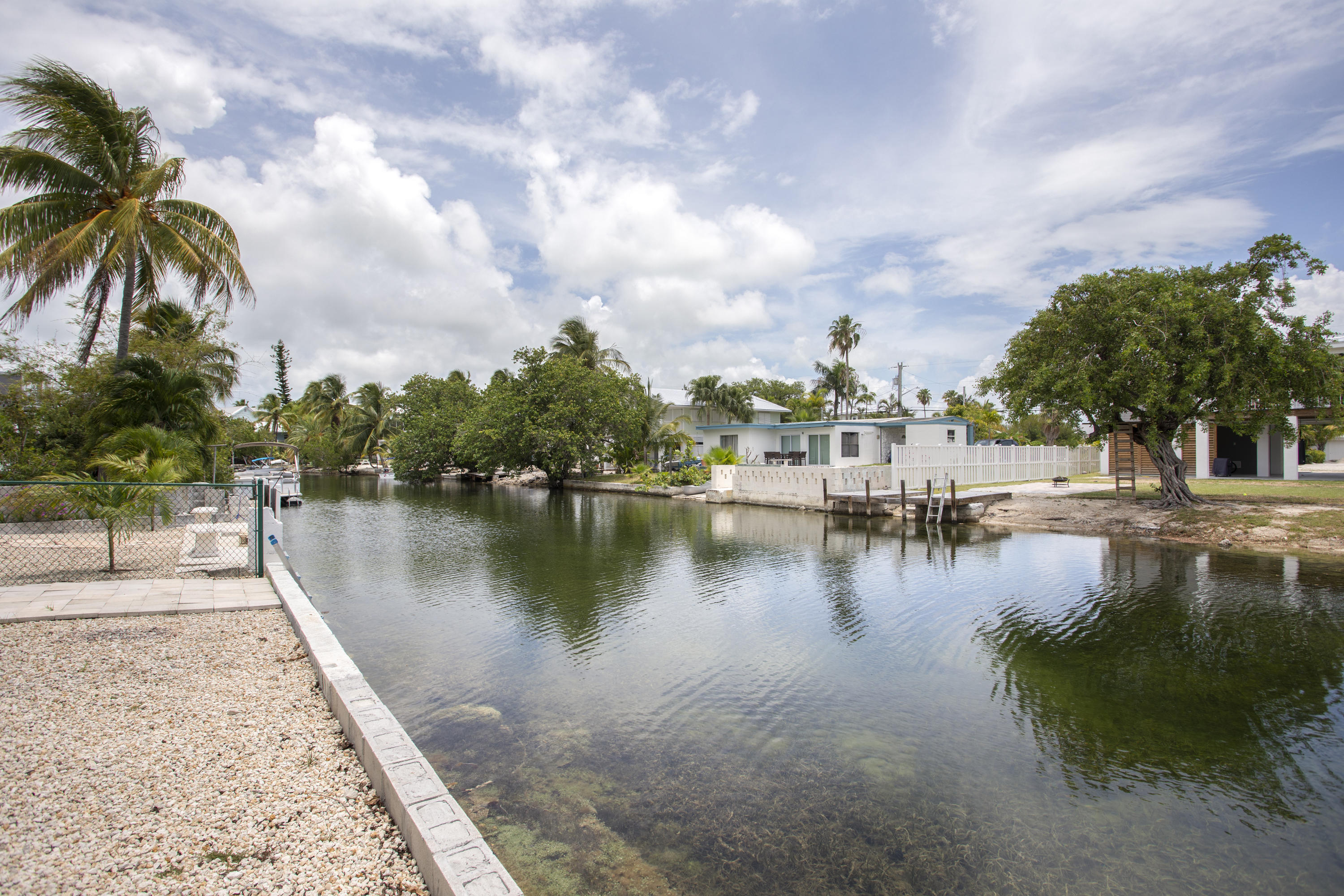59 Palm Drive Key West, FL 33040 - Photo 3 of 14 a view of a lake with a yard